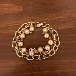 Gold and pearl three chain bracelet